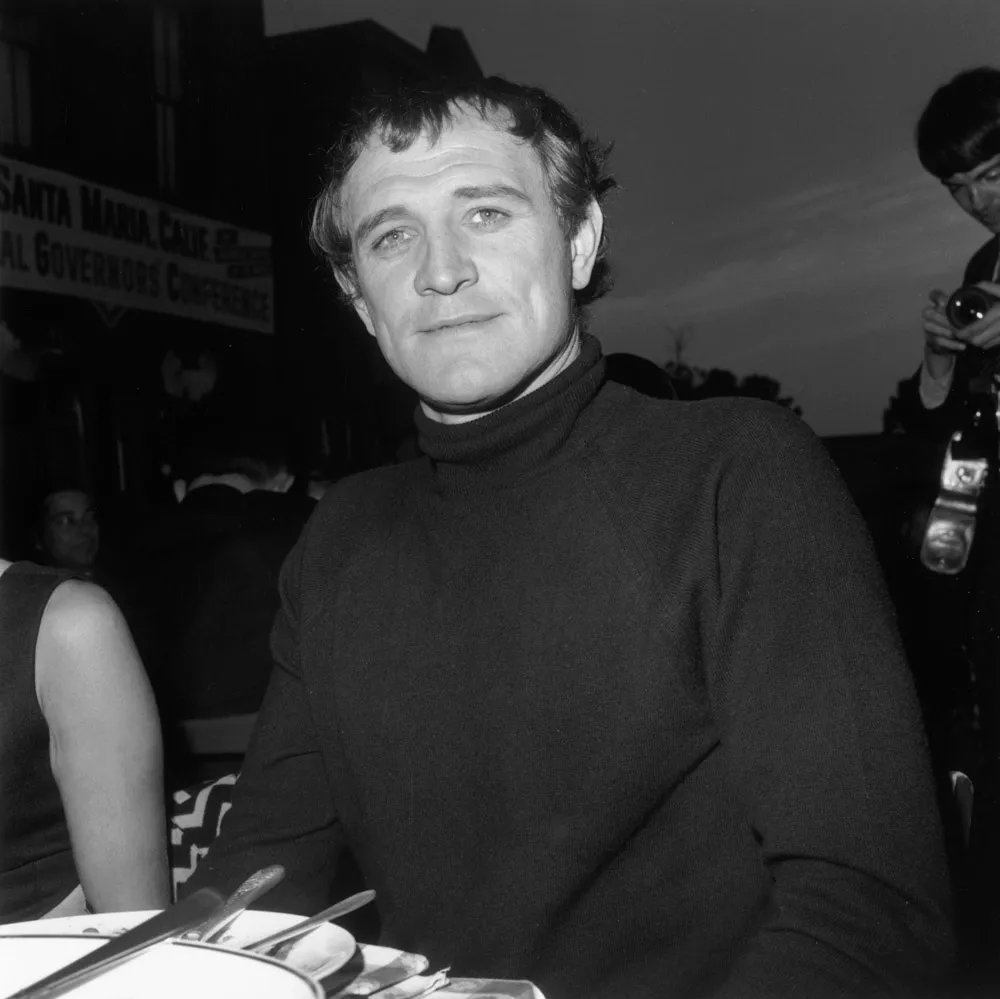 Richard Harris in black and white photo, wearing black turtleneck 