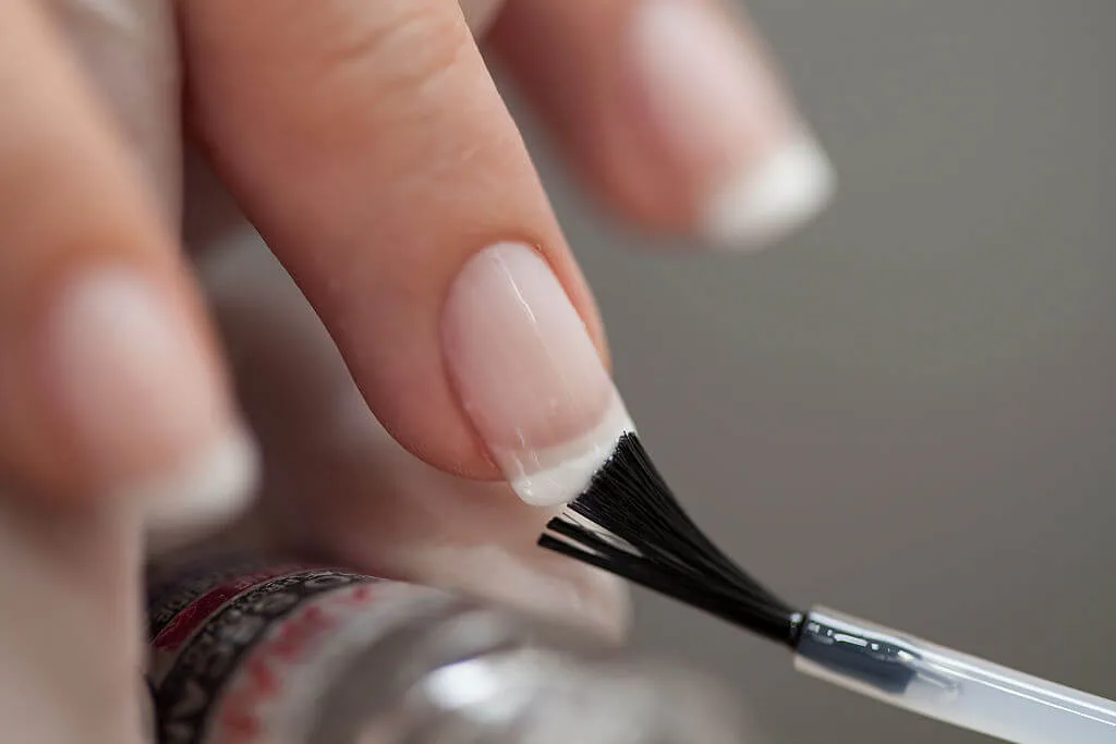 clear nail polish helps keep cracks from spreading