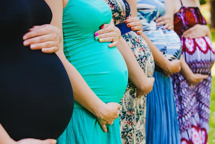 group-of-pregnant-women-holding-bellies-10725.jpg