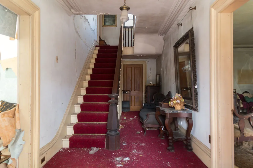 staircase covered in red carpeting