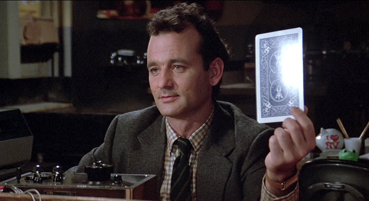 Bill Murray holds up card in Ghostbusters.