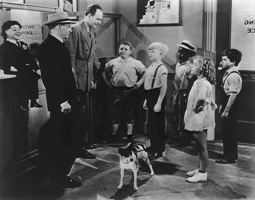 froggy, buckwheat, and others in a still from the little rascals 