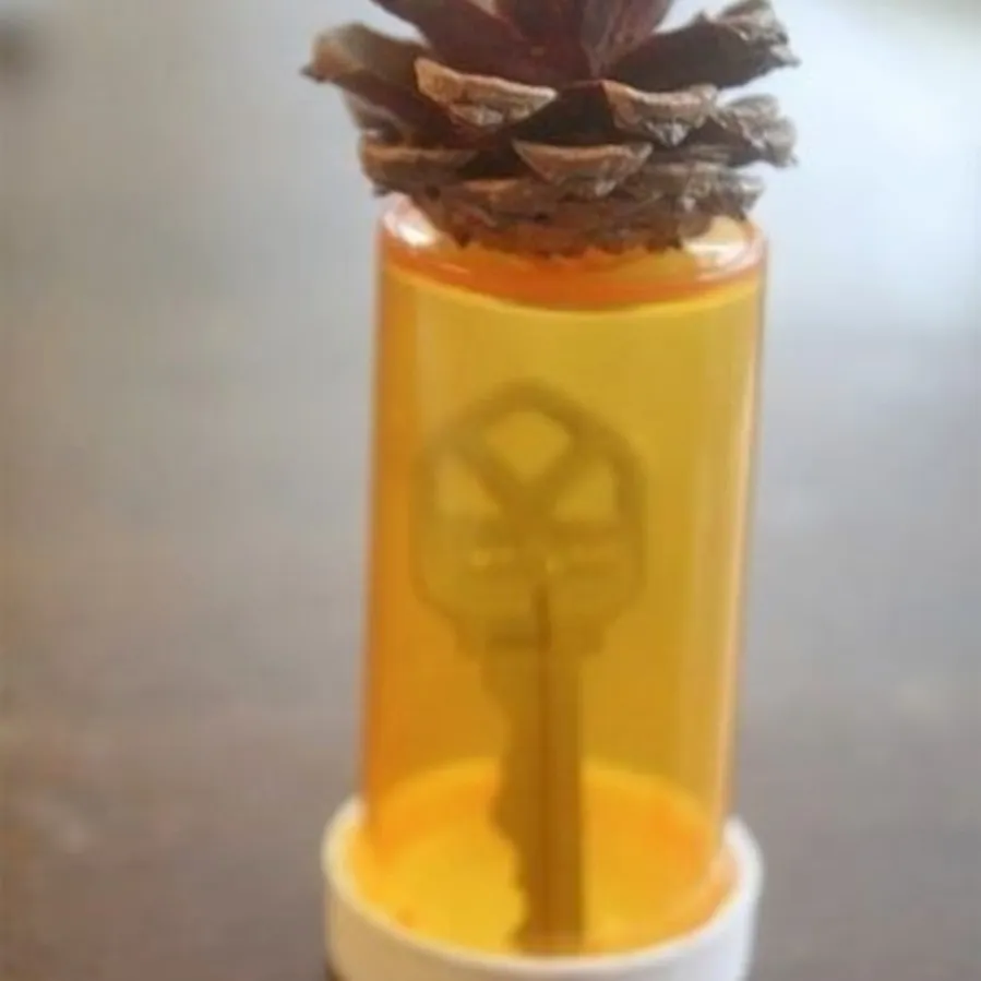 store a spare key in a pill bottle hack