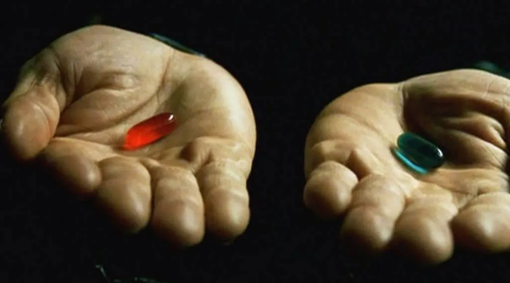 hands holding a red pill and a blue pill
