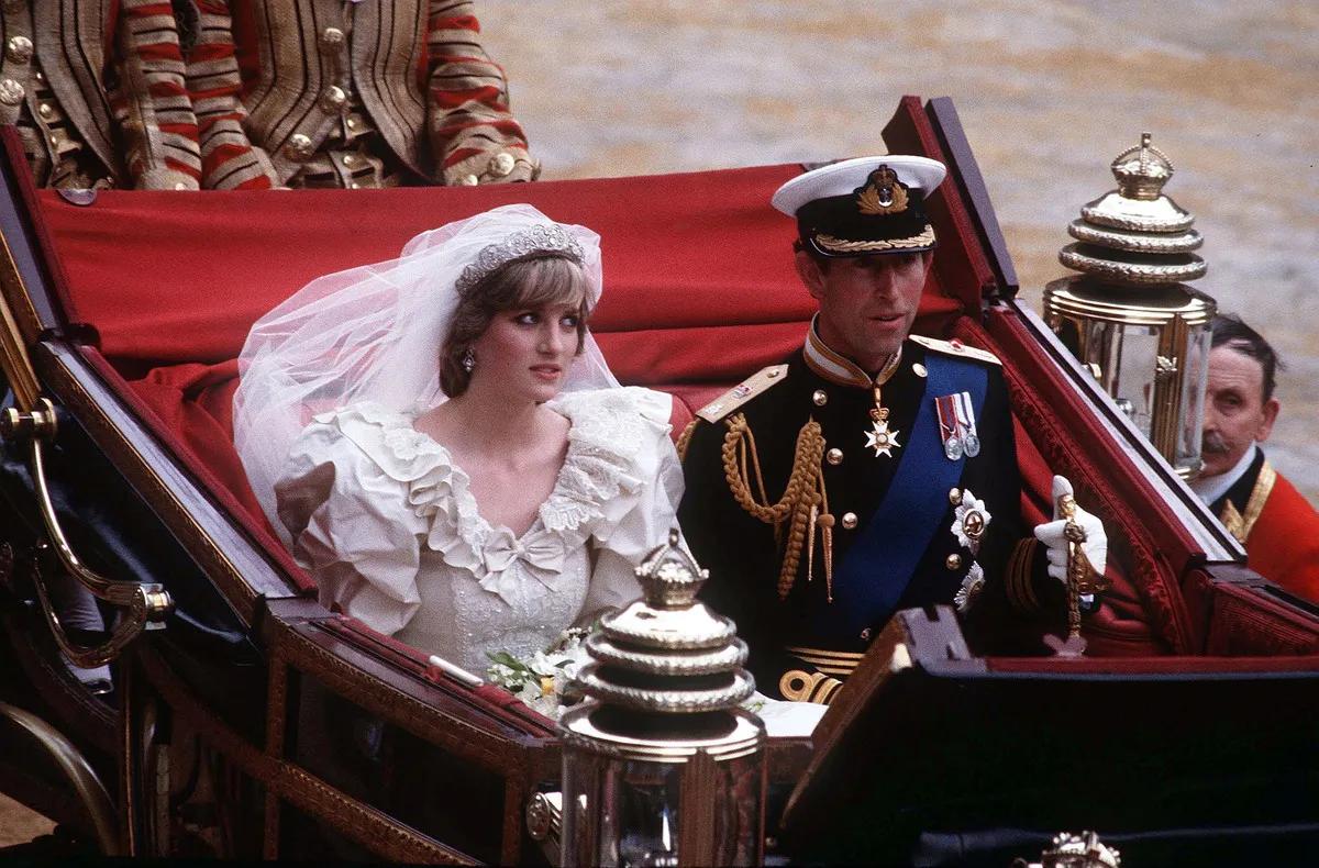 Diana, Princess of Wales and Prince Charles ride in a carriage after their wedding at St. Paul's Cathedral July 29, 1981 in London.