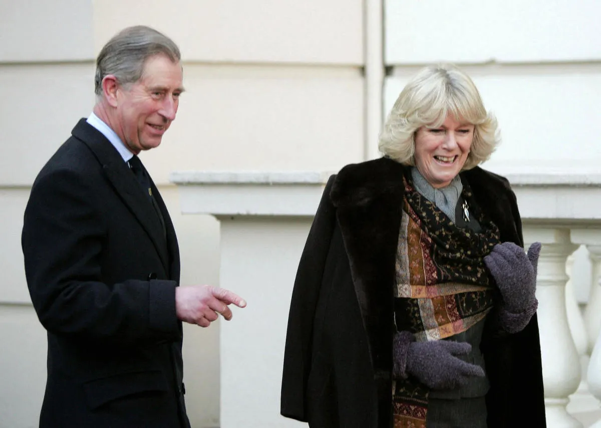 Britain's Prince Charles stands with his fiancee Camilla Parker Bowles during an engagement at Clarence House in London where they met with British explorers 21 February 2005.