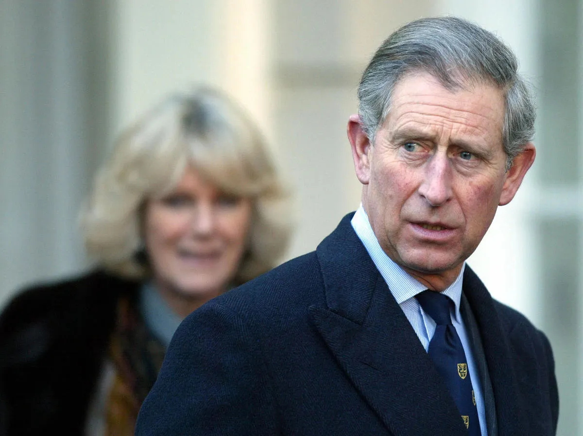 Britain's Prince Charles stands with his fiancee Camilla Parker Bowles (L) during an engagement at Clarence House in London where they met with British explorers 21 February 2005. 