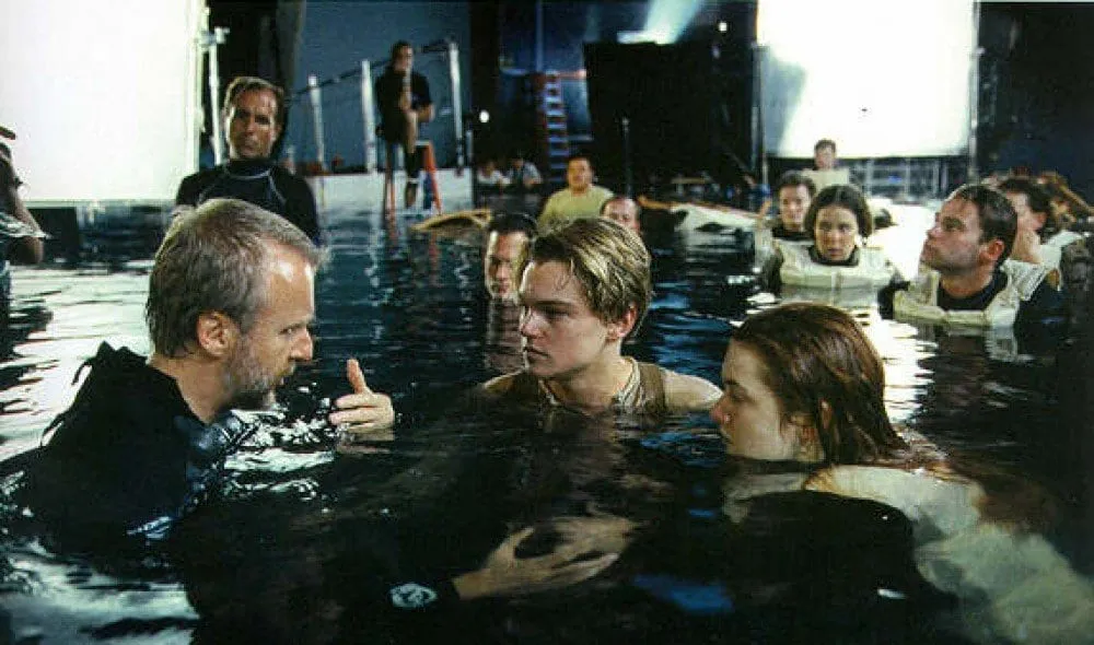 James Cameron talking to the actors in the water