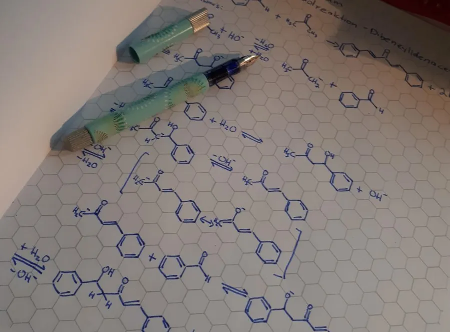 Organic chemistry notes written on hexagonal graph paper