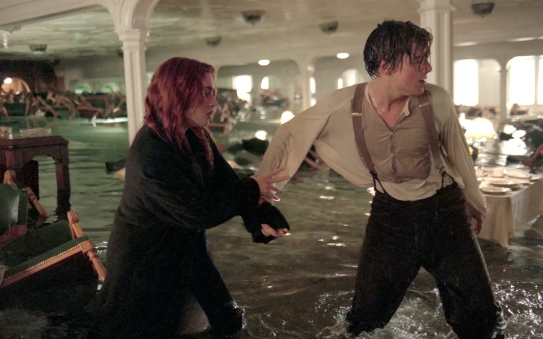 Rose and Jack wade through flooding ship in a scene from Titanic