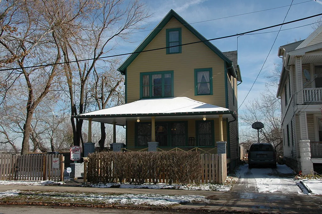 exterior of the yellow and green house from a christmas story