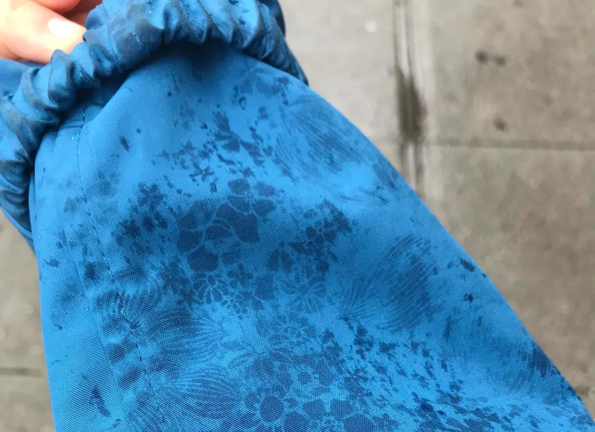 blue raincoat displays flowers when it gets wet on Reddit