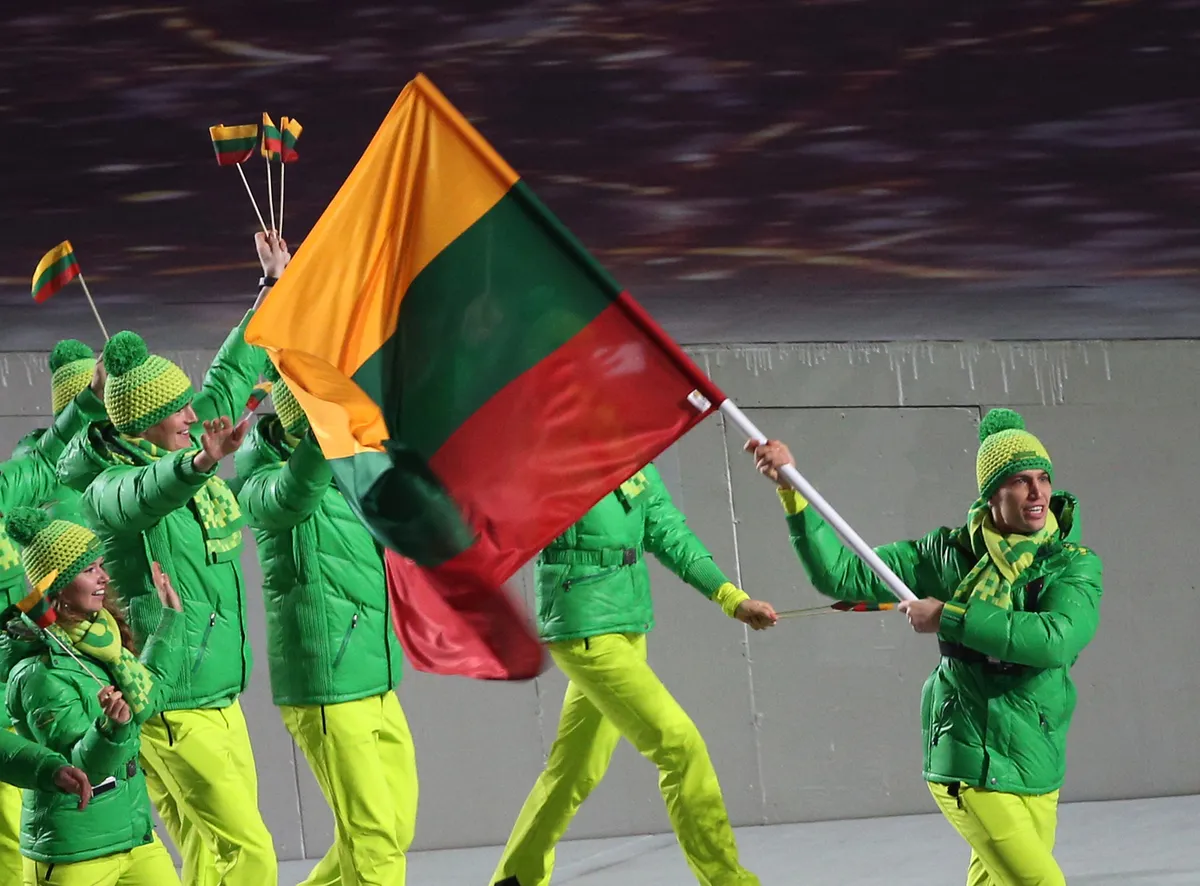 Team Lithuania with flag bearer Deividas Stagniunas enter the stadium during the Opening Ceremony in Fisht Olympic Stadium at the Sochi 2014 Olympic Games, Sochi, Russia, 07 February 2014.