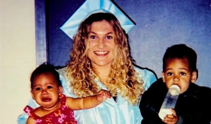 Lydia Fairchild in graduation cap with her two children