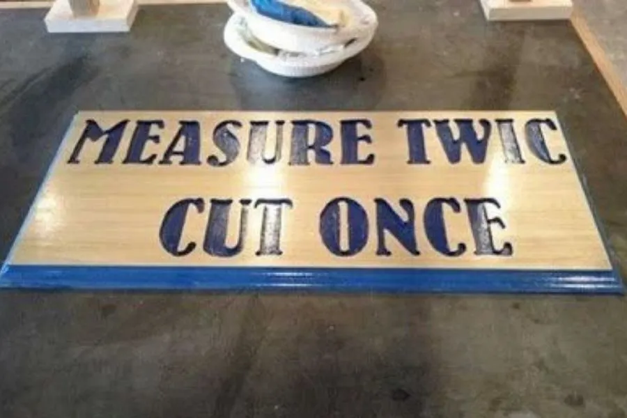 measure twice cut once sign with mistake