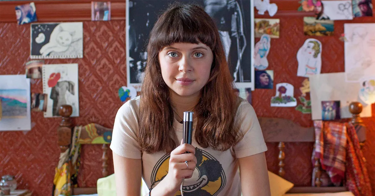 bel powley holding a microphone in the diary of a teenage girl