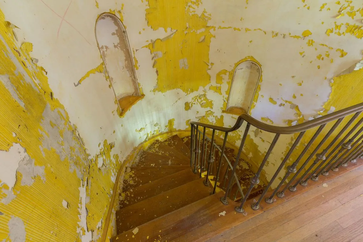 top of yellow staircase circus house abandoned house story