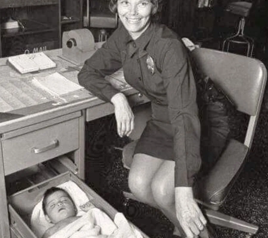 working mom with baby in desk
