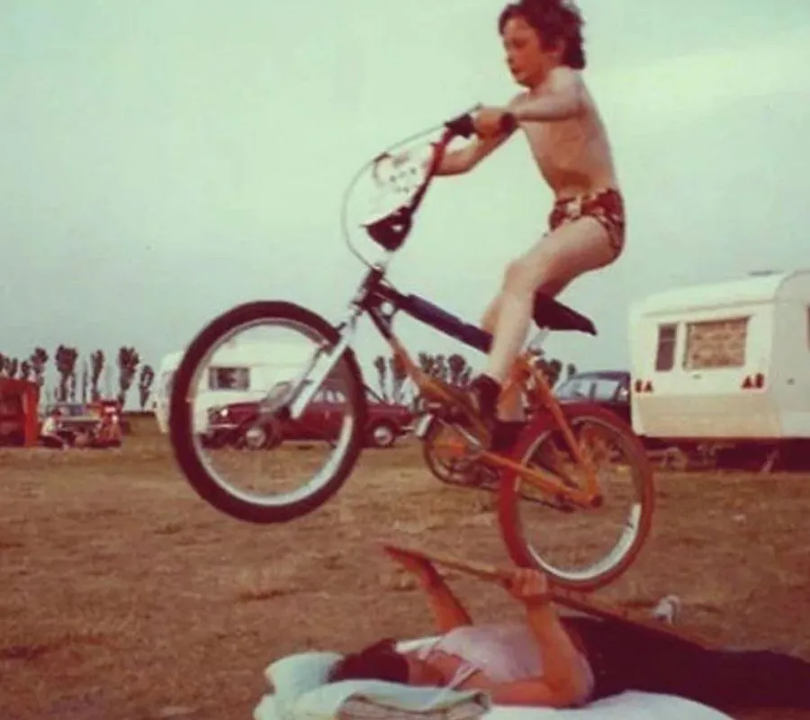 kid biking over mother