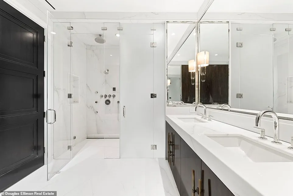 The largest bathroom pictured, double sinks lead towards a separate shower space that doubles the bathroom's size.