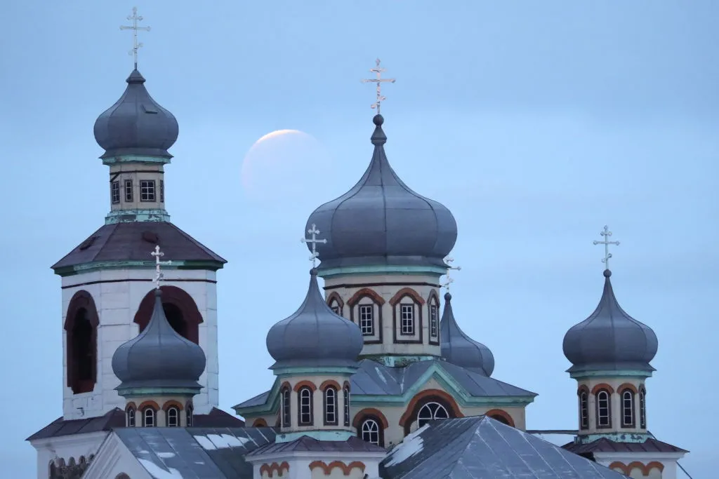 A lunar eclipse is captured over a church in Belarus