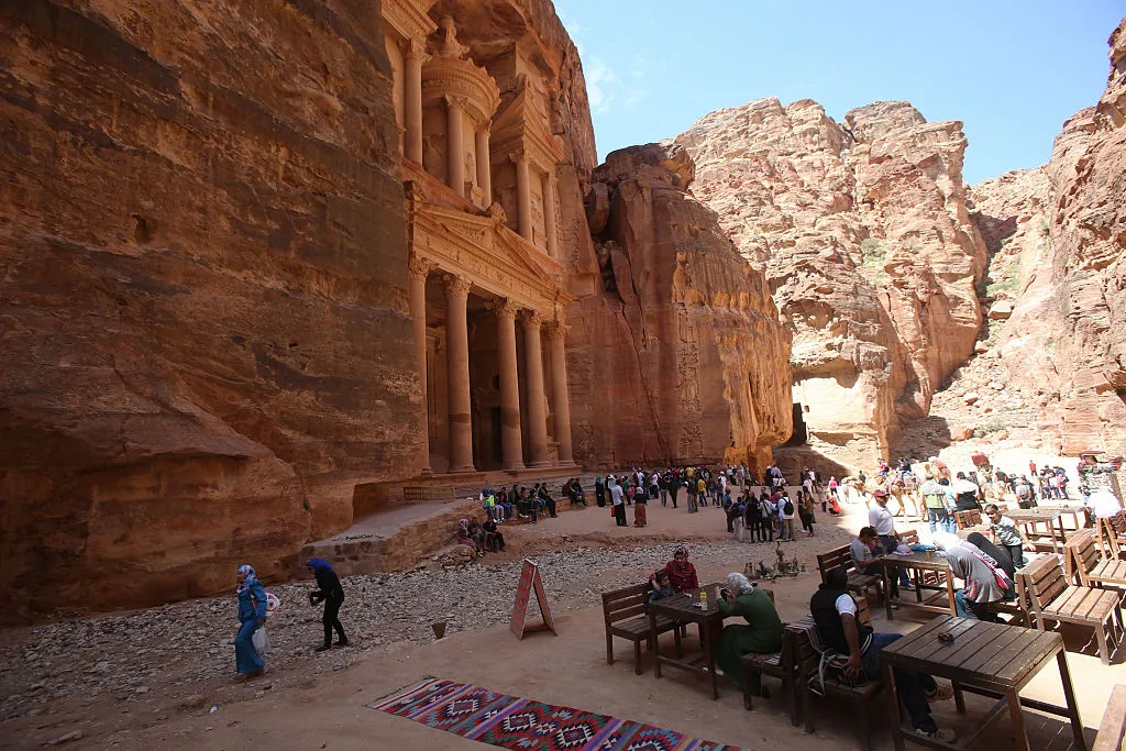 Tourists view the archeological site of Petra in Jordan