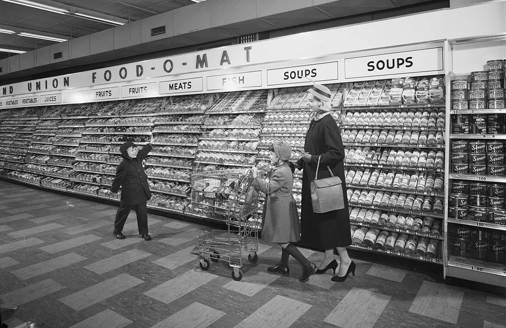 Mother with children in supermarket 