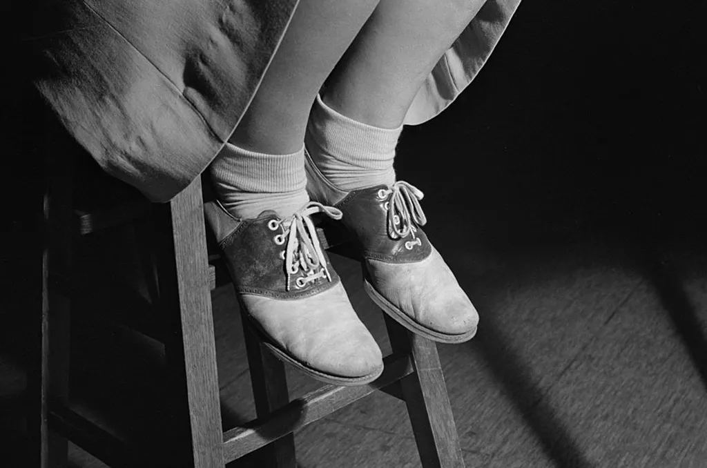 Girl wearing saddle shoes 