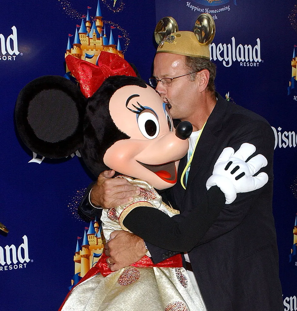 Kelsey Grammer with Minnie Mouse during Disneyland 50th Anniversary 