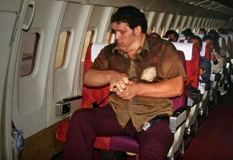 andre the giant on a plane in the 1980s