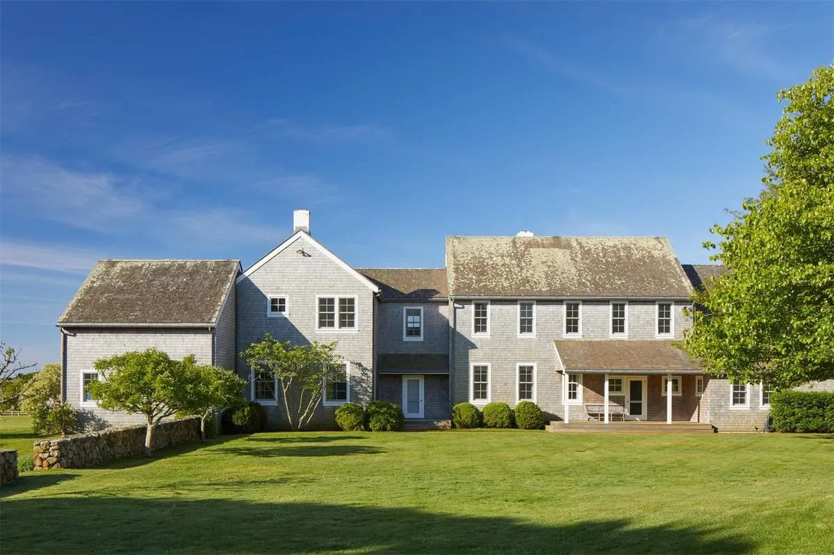 A view of the houses rear shows a large backyard