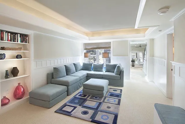 A large living space offers plenty of seating and light