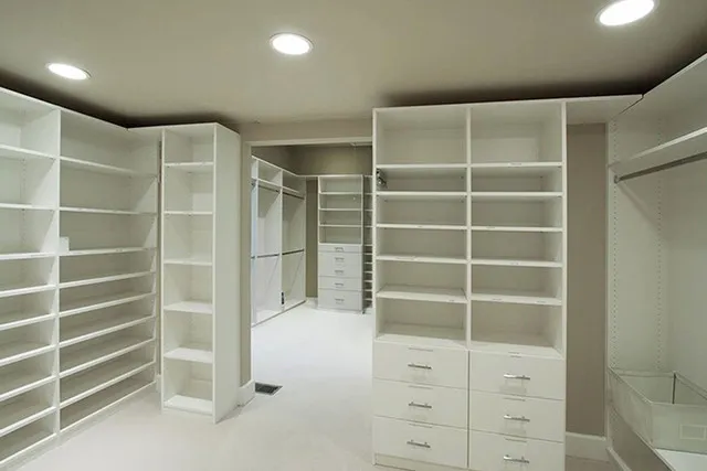 Shelving adorns every space in this huge closet, which leads to another closet beyond
