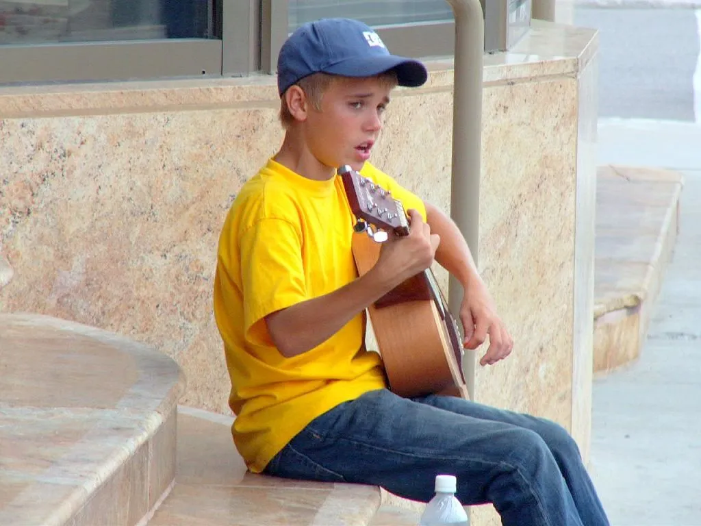 younger with guitar 