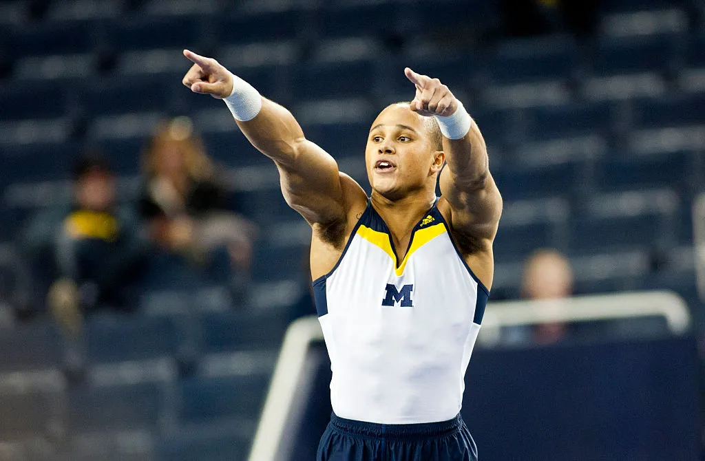 stacey ervin jr doing a floor routine at michigan