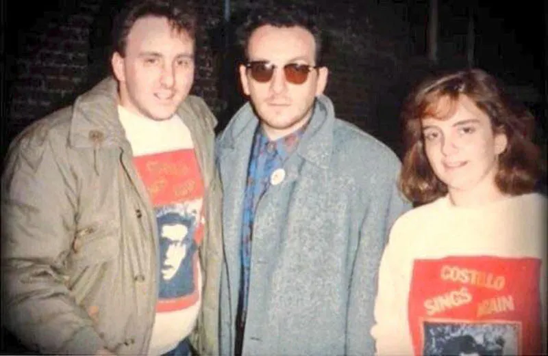 Tina Fey poses for a fan photo with Elvis Costello