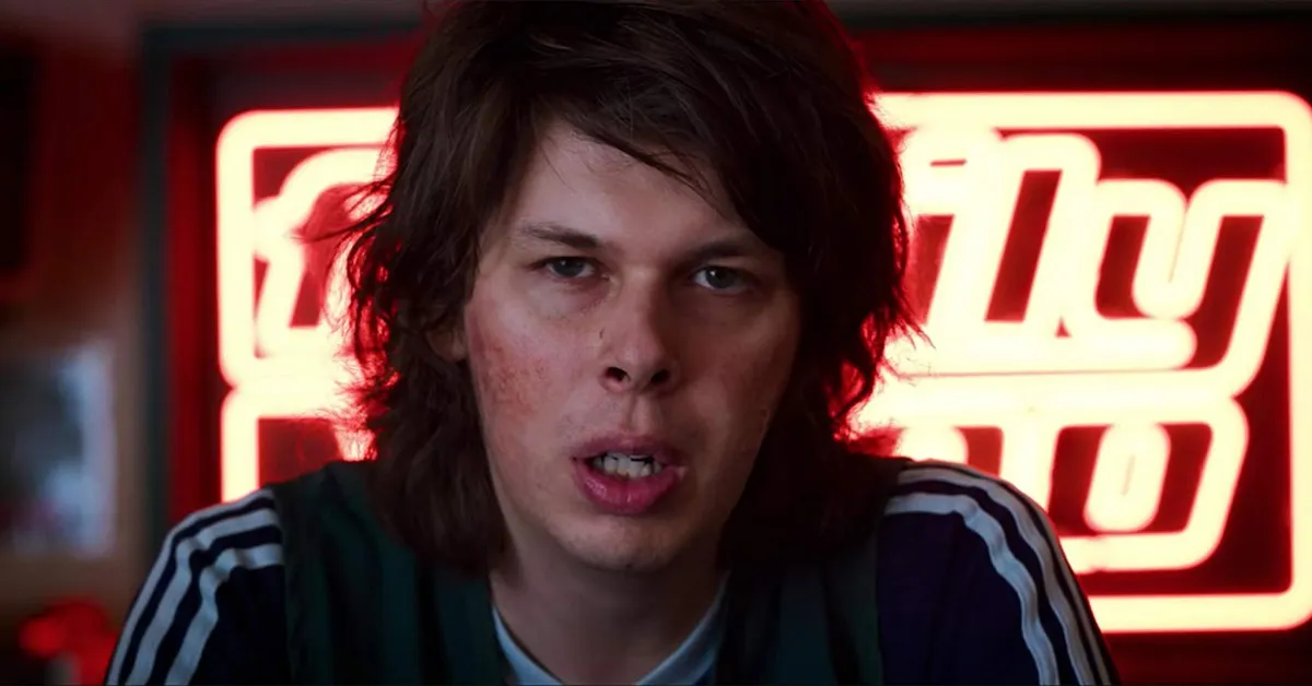 matty cardarople in front of a neon sign