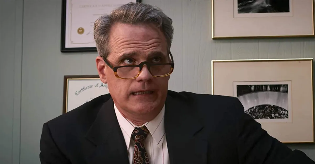 michael park wearing a suit in an office