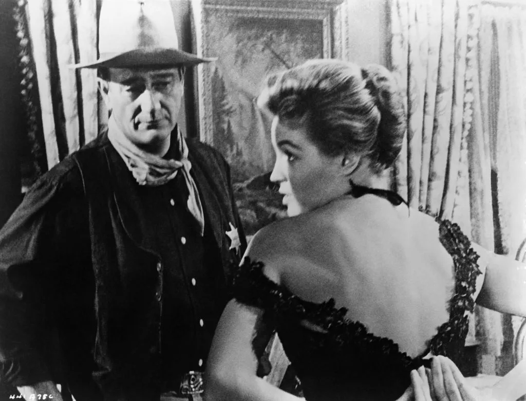 John Wayne and Angie Dickinson on the set of the movie 'Rio Bravo' in 1959 in Tucson, Arizona