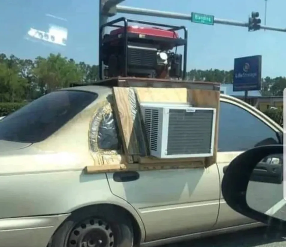 Person has air conditioning unit through their car window