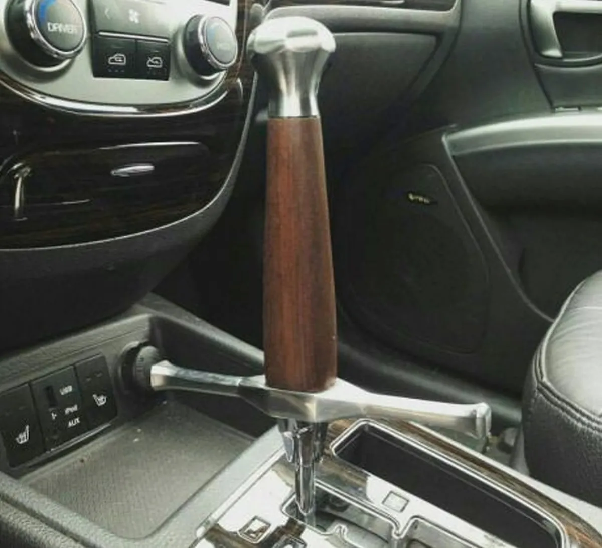 person uses sword hilt for gear shift