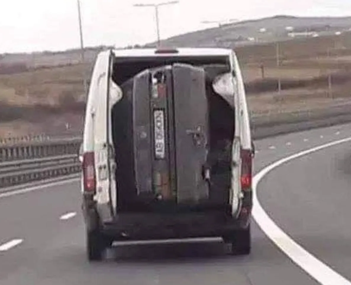 Person fits small car in back of van