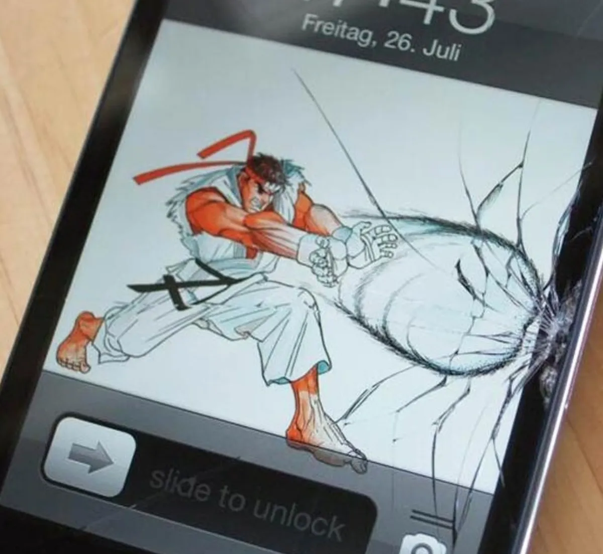 Person comically uses wallpaper to make cracked screen look cool