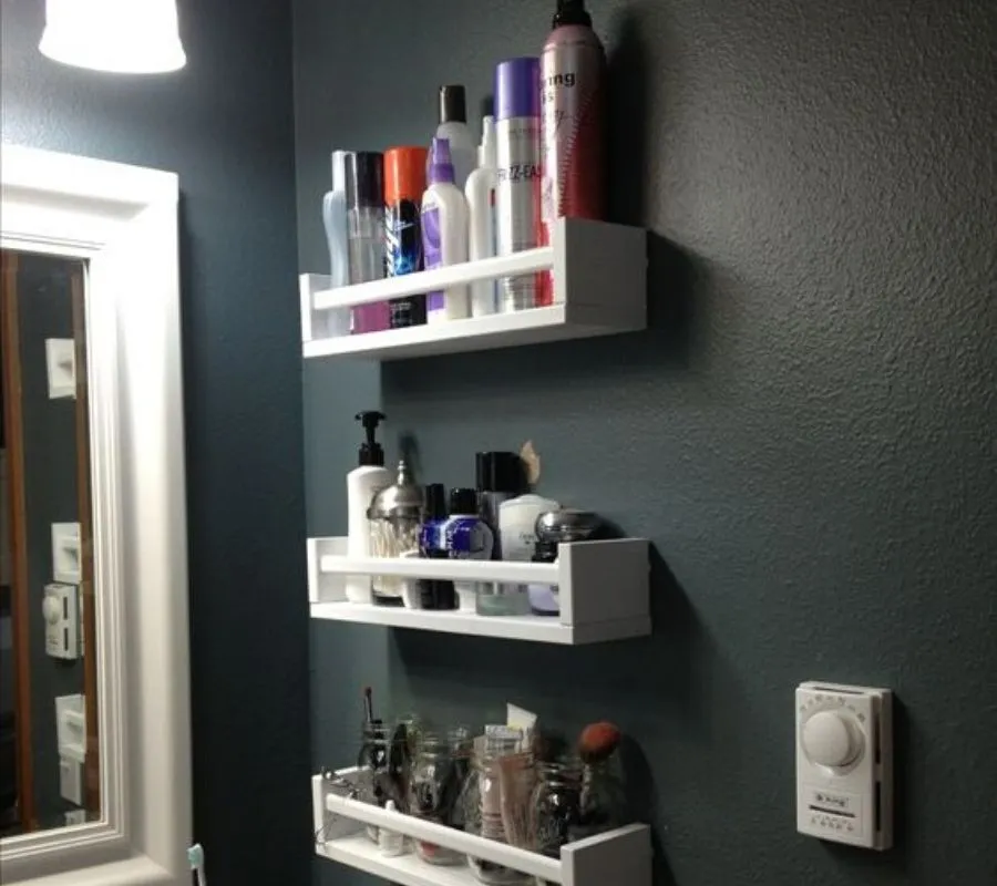 using spice racks for bathroom storage