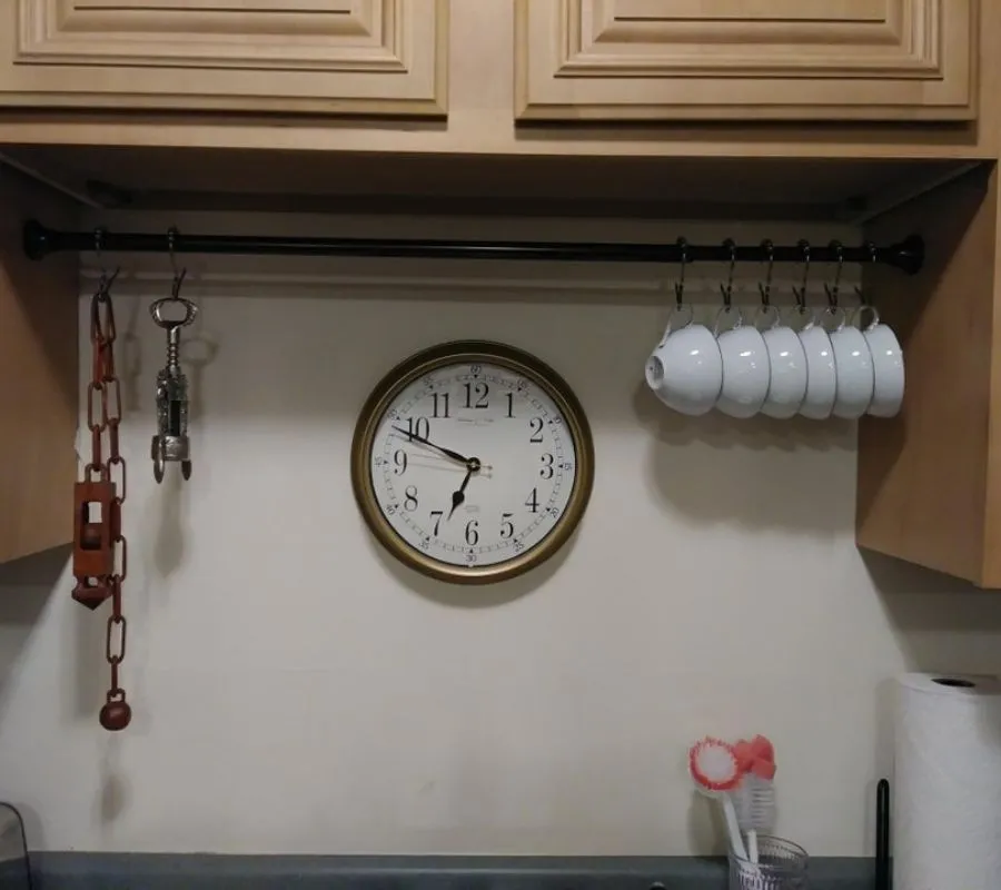 using tension rod for kitchen storage 