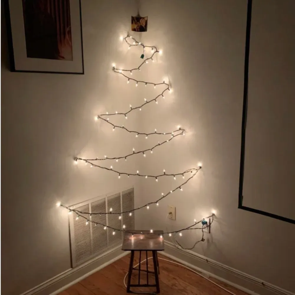 strung up lights and wooden stool shaped to look like christmas tree