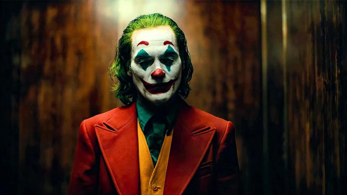 Joaquin Phoenix in costume and makeup as the joker