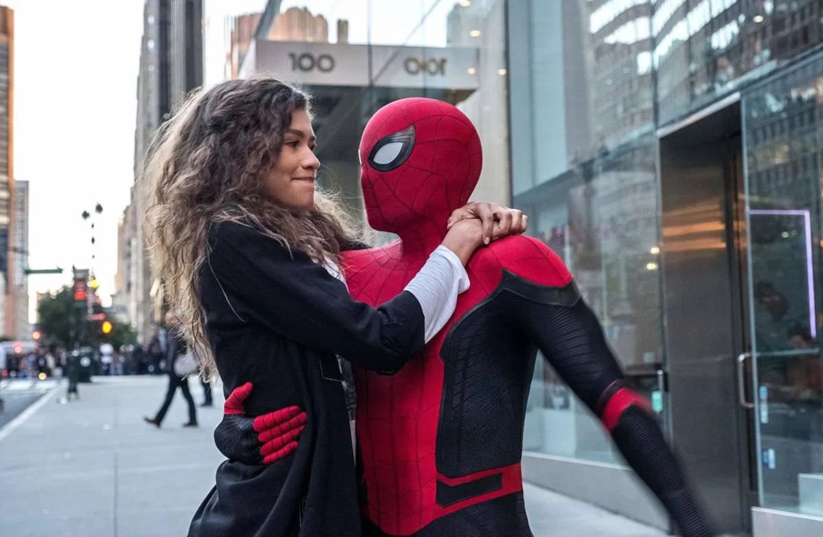 zendaya hugging spider-man on a sidewalk