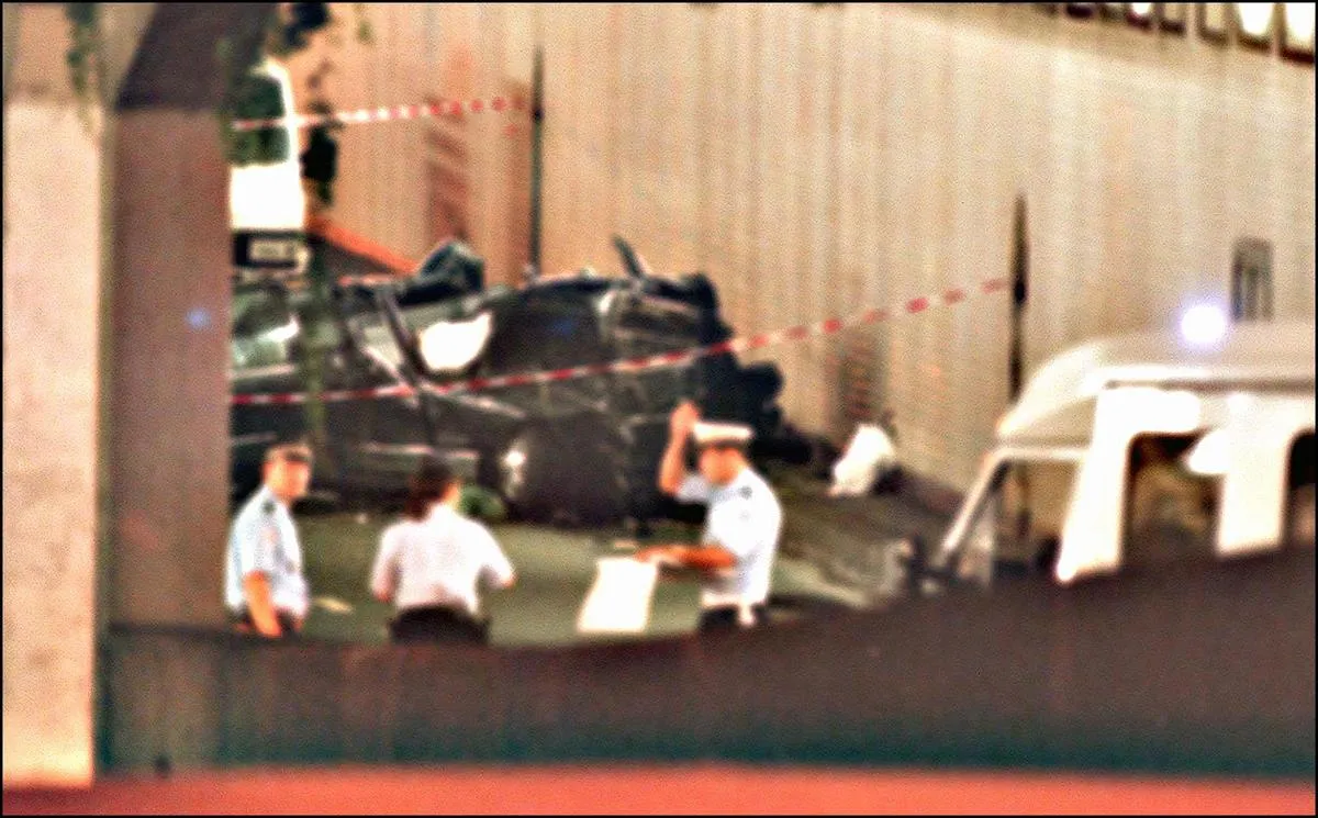 Police mark off the wreckage of Princess Diana's car.