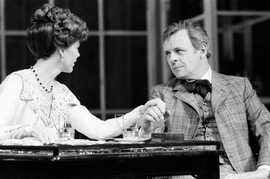 Anthony Hopkins performs with an actress onstage.